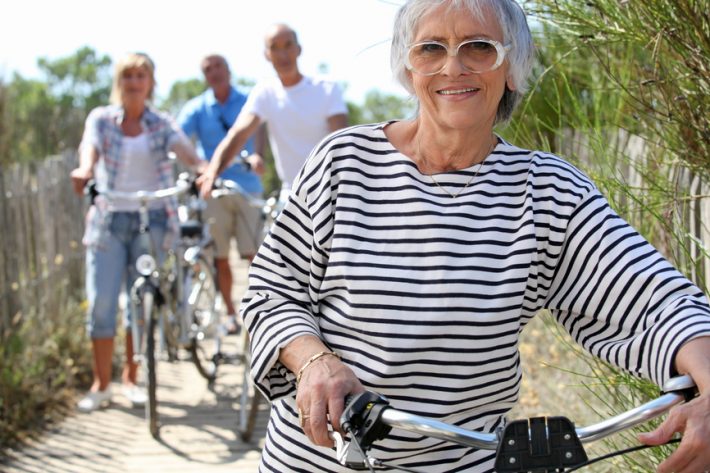 Older woman and friends on a bike ride